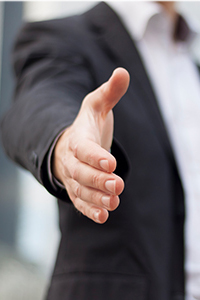 Hand reaching out to offer a greeting funeral plans uk