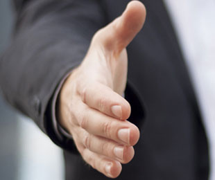 Hand being offered to shake funeral payment plans